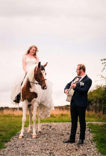 James and Faye with wedding horse